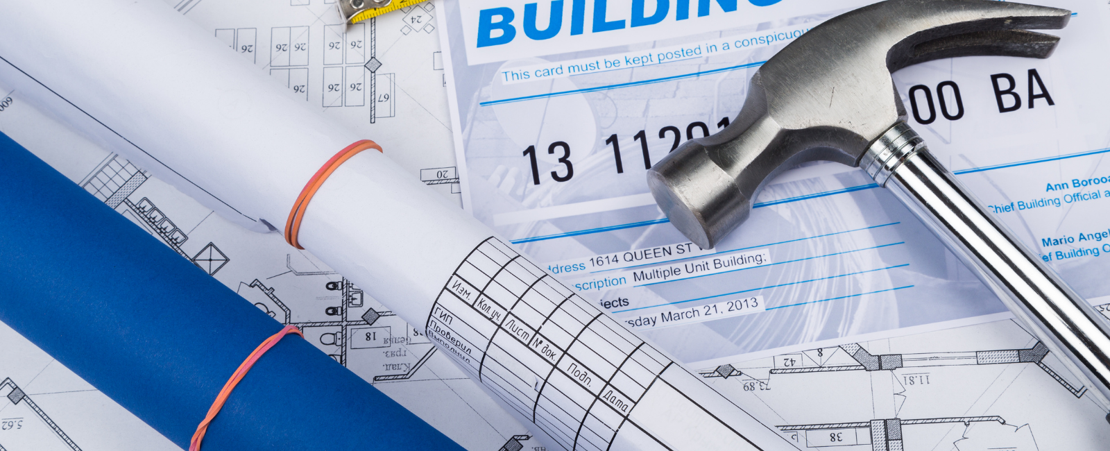 Map, hammer and building permit application form.